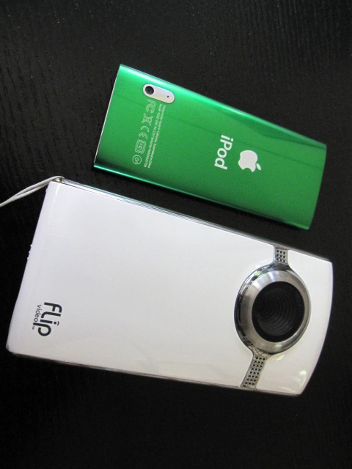 Photo of iPod Nano next to Flip Ultra HD camcorder.