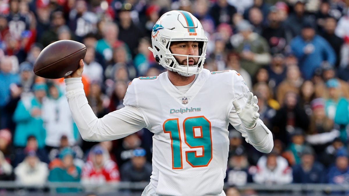 Quarterback Skylar Thompson of the Dolphins attempts to throw a football