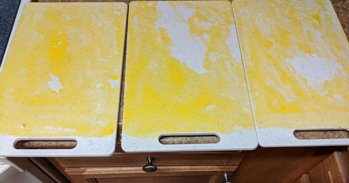 Results from a test seeing which showerhead could rinse the most egg yolk off of a cutting board.