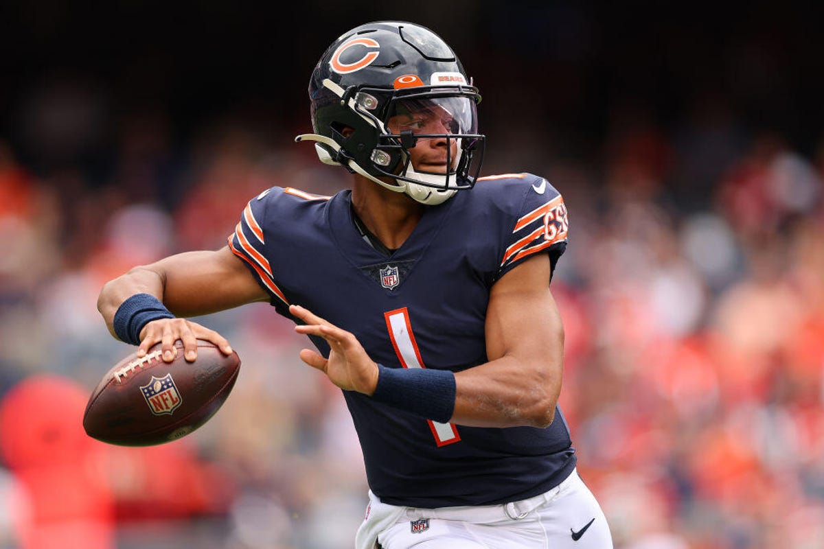 Quarterback Justin Fields of the Chicago Bears moves to throw the ball