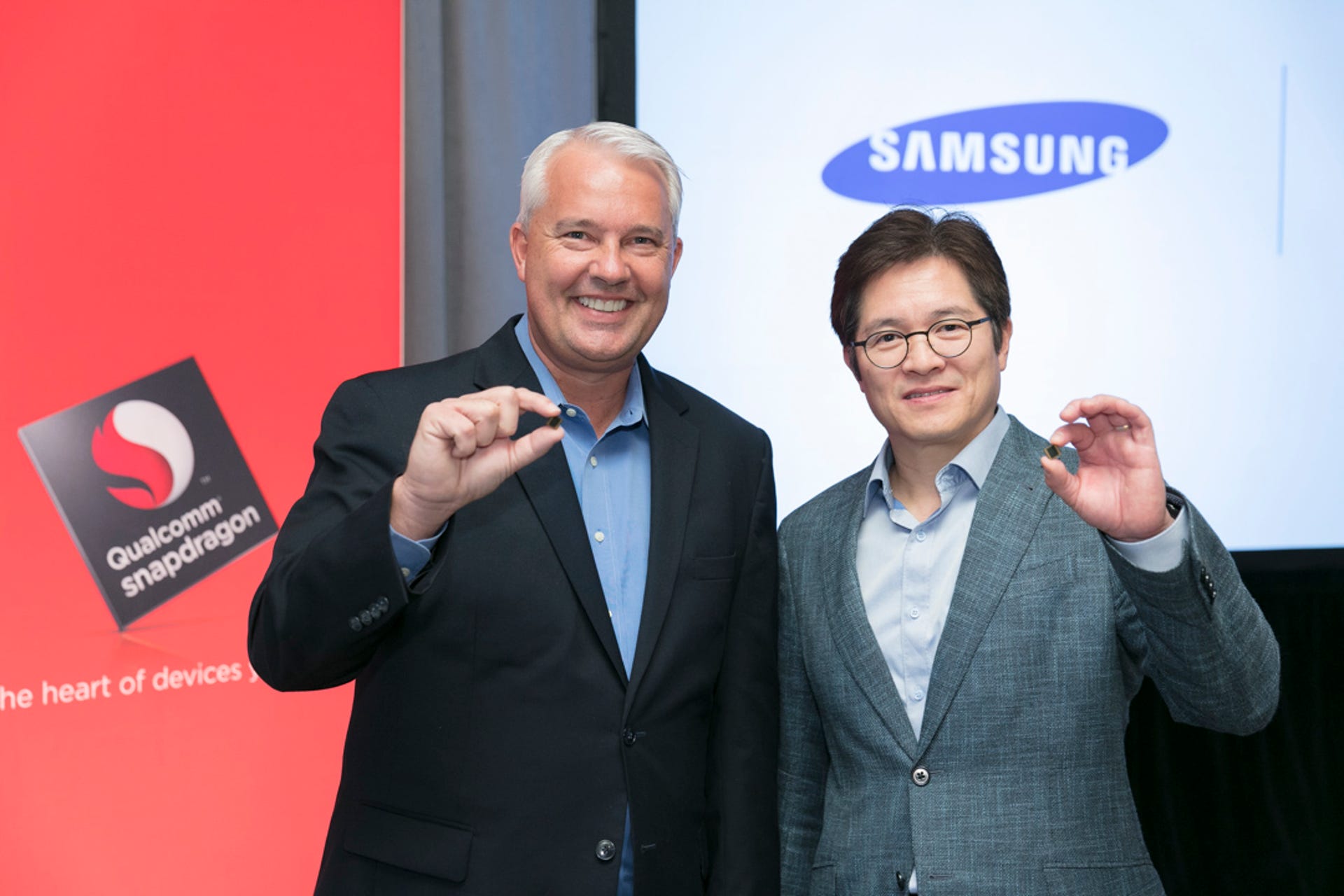Keith Kressin, left, senior vice president of product management for Qualcomm, and Ben Suh, senior vice president of foundry marketing for Samsung, show off the Snapdragon 835.