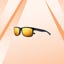Roka sunglasses against an orange background.