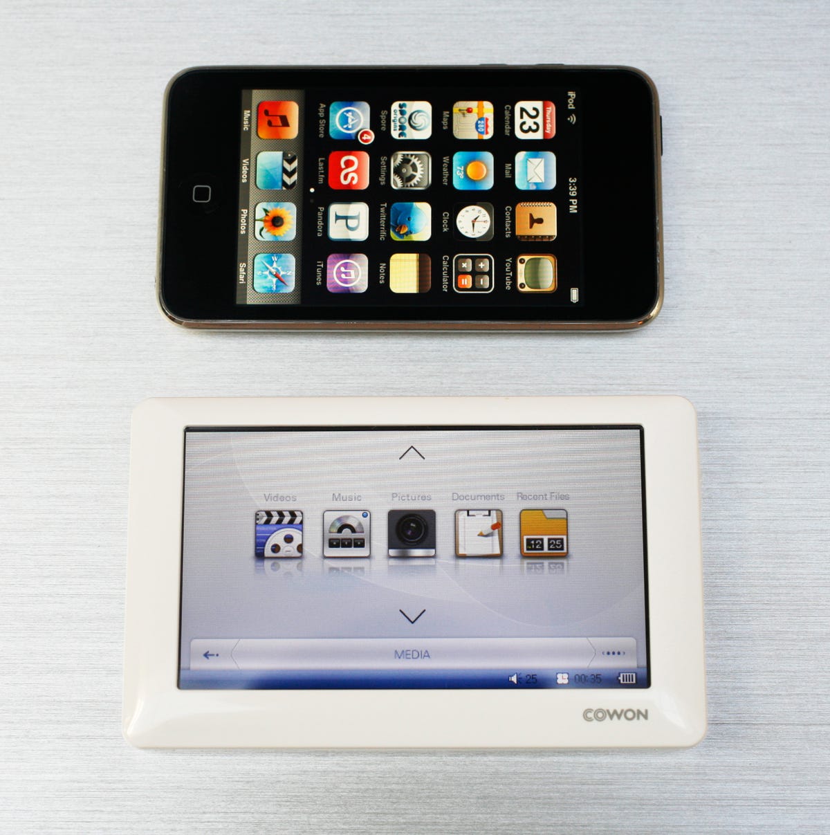 Photo of the Cowon O2 next to the Apple iPod Touch.
