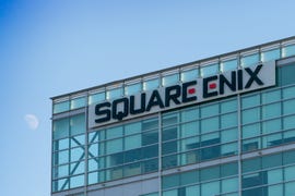 A glass building with a Square Enix sign.
