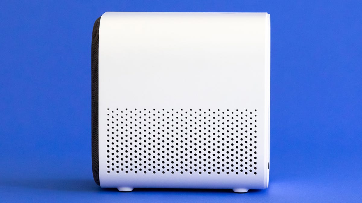 The side view of the Xiaomi Mi Smart Projector 2 with a bunch of small, round vent holes.