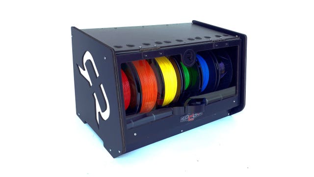 A black wooden box with 6 different color filaments inside