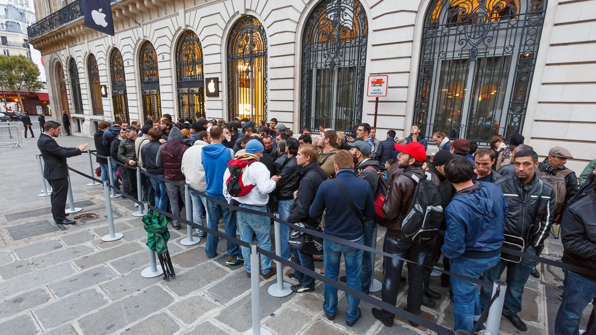 In Paris, Apple sequestered the earliest arrivals in the line to buy the iPhone 5S and 5C into a section near the Opera store. People dressed warmly for the cool but dry weather.