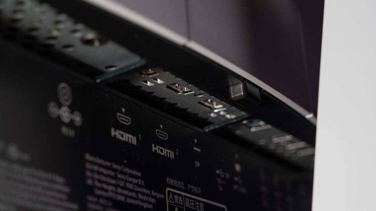 A close up of the connections recessed in the back of the monitor