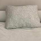 Helix pillow on a white bed