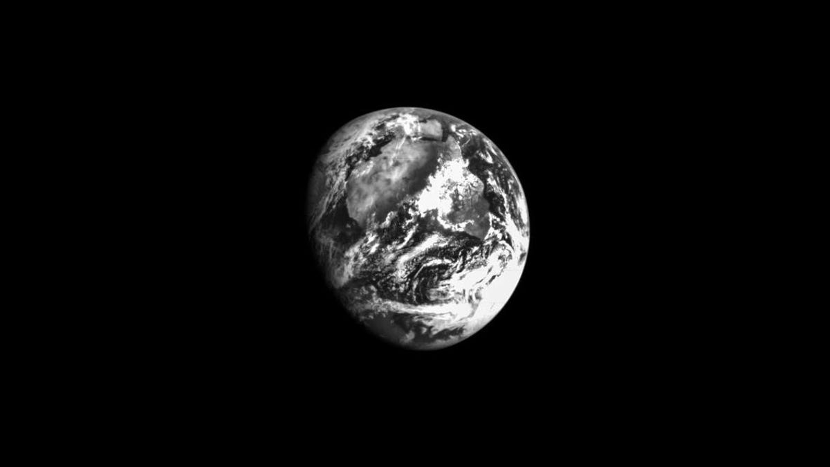 A partial view of Earth in black and white against nothing but black.