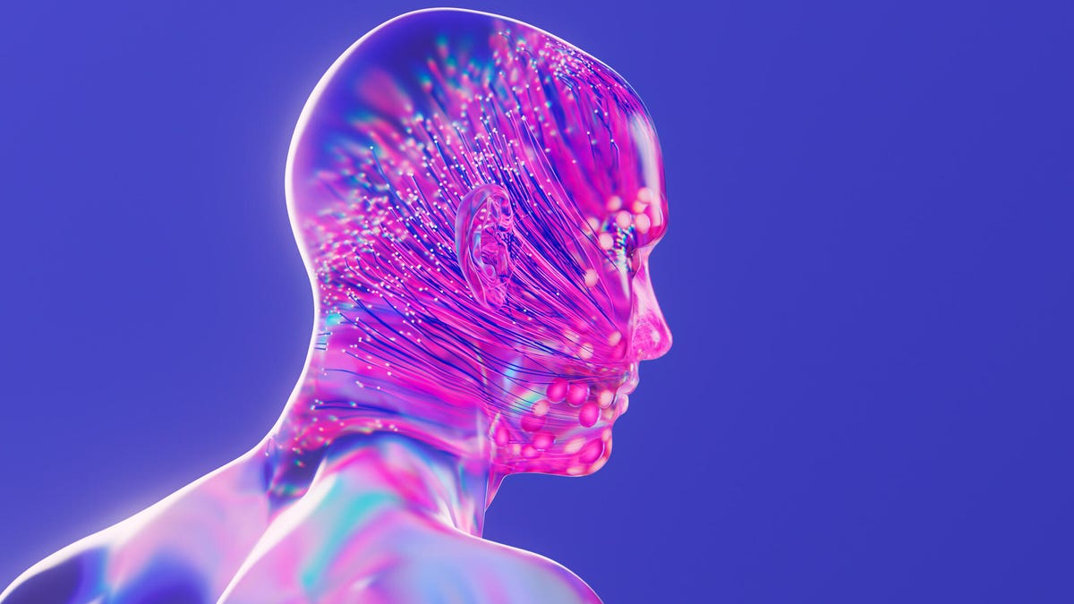 Photoshopped double exposure showing a human head filled with streams of data. It has a futuristic, cyber feel, with neon colors and glowing highlights.