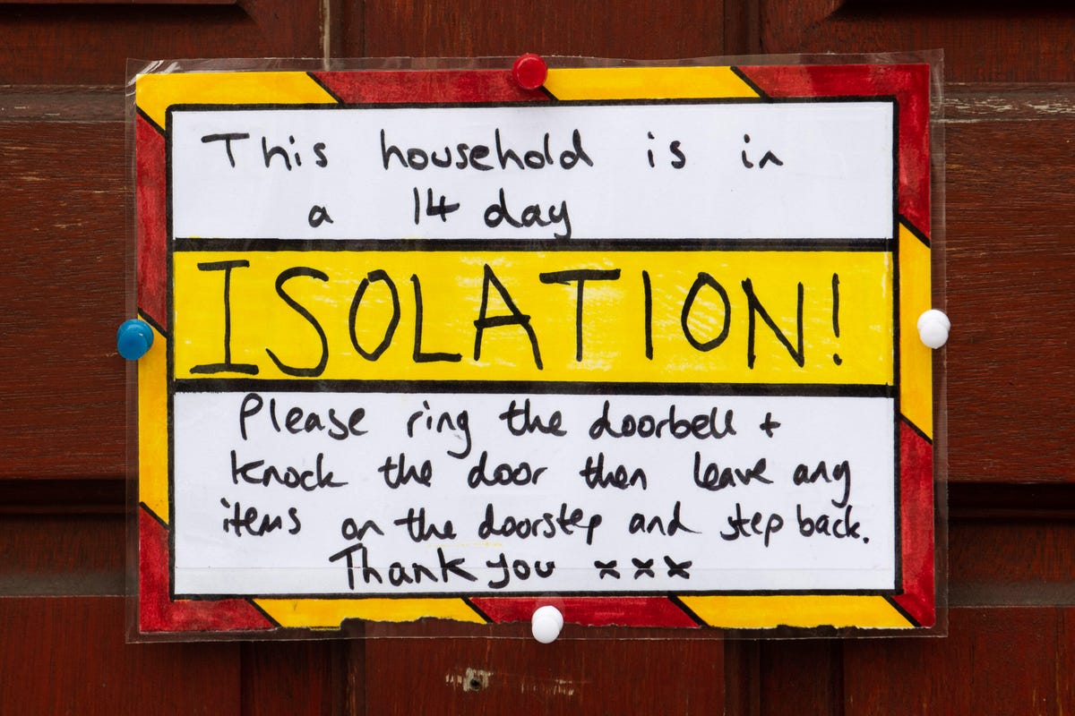 Sign on door: This household is in a 14 day isolation