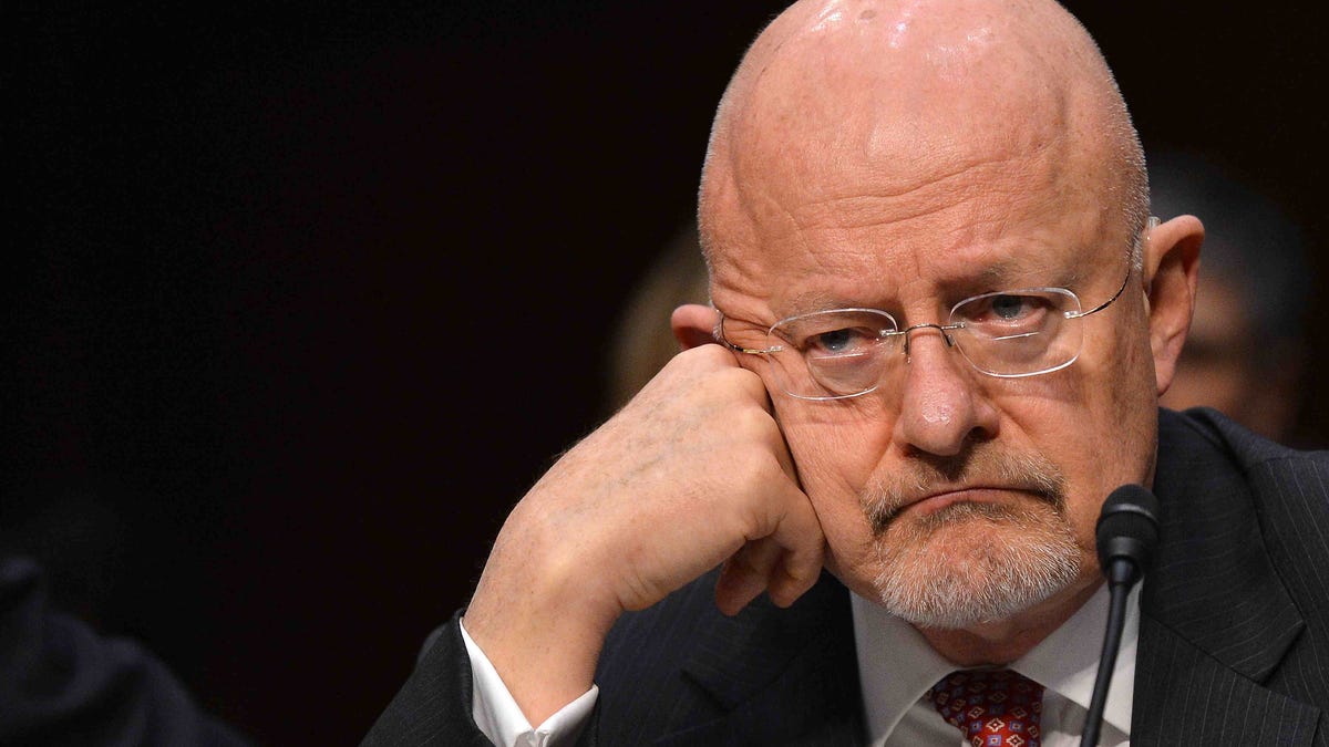 Director of National Intelligence James Clapper, in a March file photo, denied that NSA analysts snoop on Americans' communications without "proper legal authorization," but did not say what "proper legal authorization" might be.
