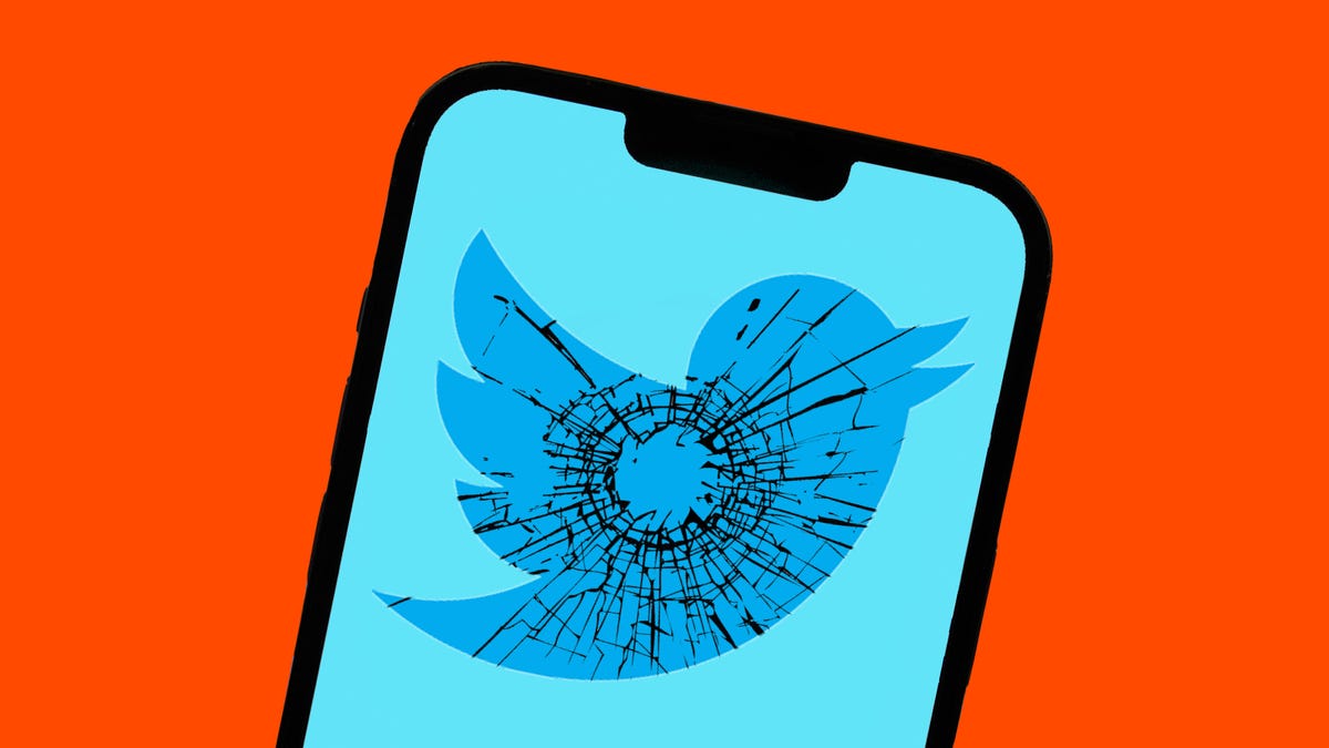 A phone shows Twitter's bird logo, with imagery of a gunshot shattering glass