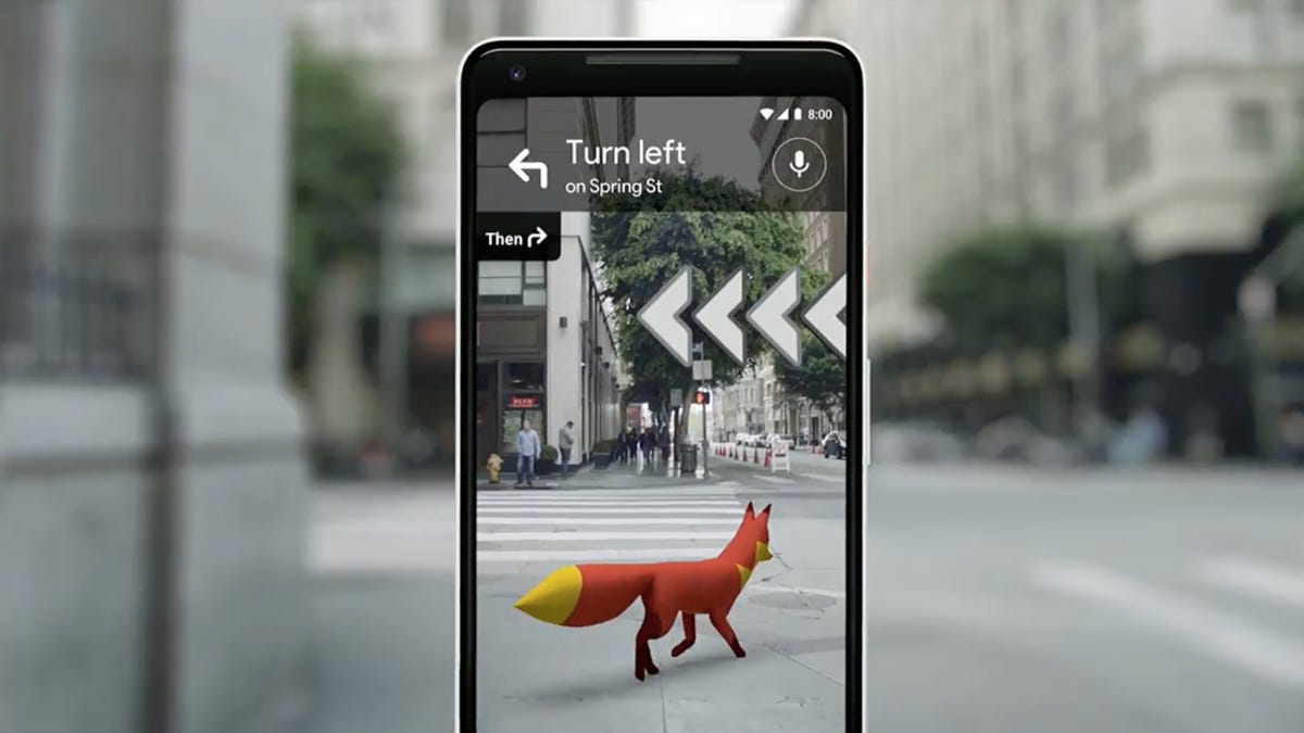 a fox is overlaid on a phone&apos;s view of a street in an AR maps app
