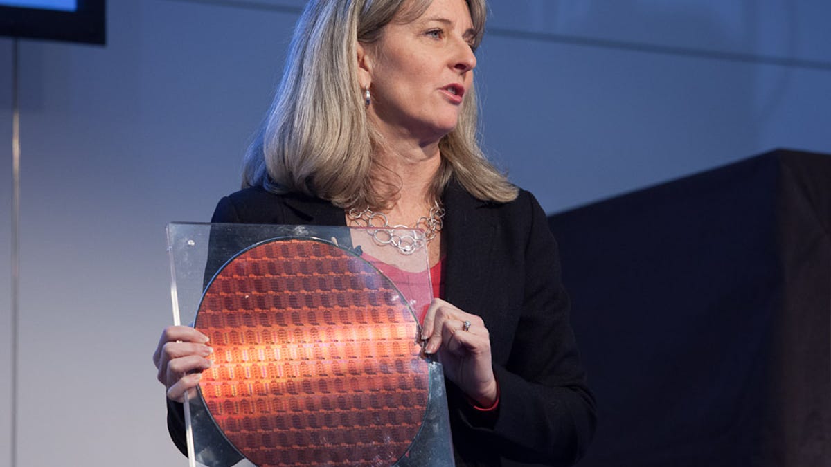 Lisa Graff, general manager of Intel's data center platform engineering group, holds a 300mm wafer of Intel's E5 Xeon processors.