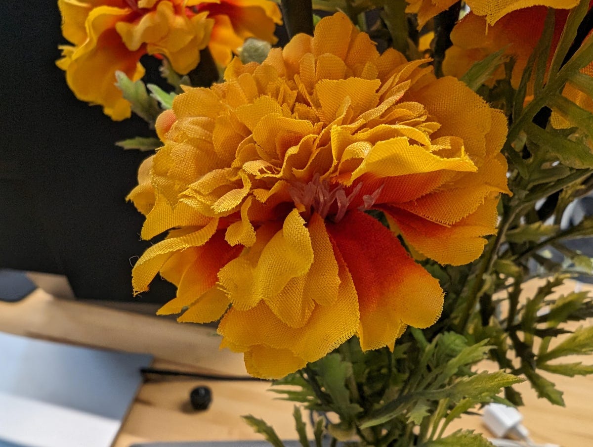 An artificial flower on a desk