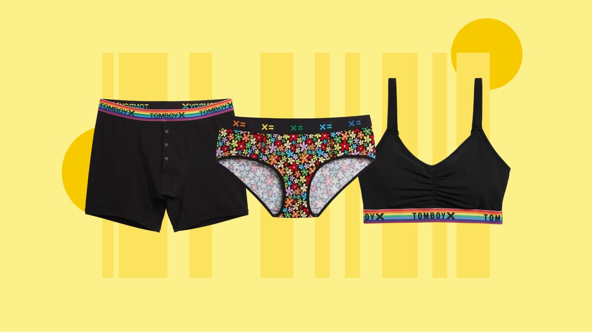 Various styles of underwear from TomboyX are displayed against a yellow background.