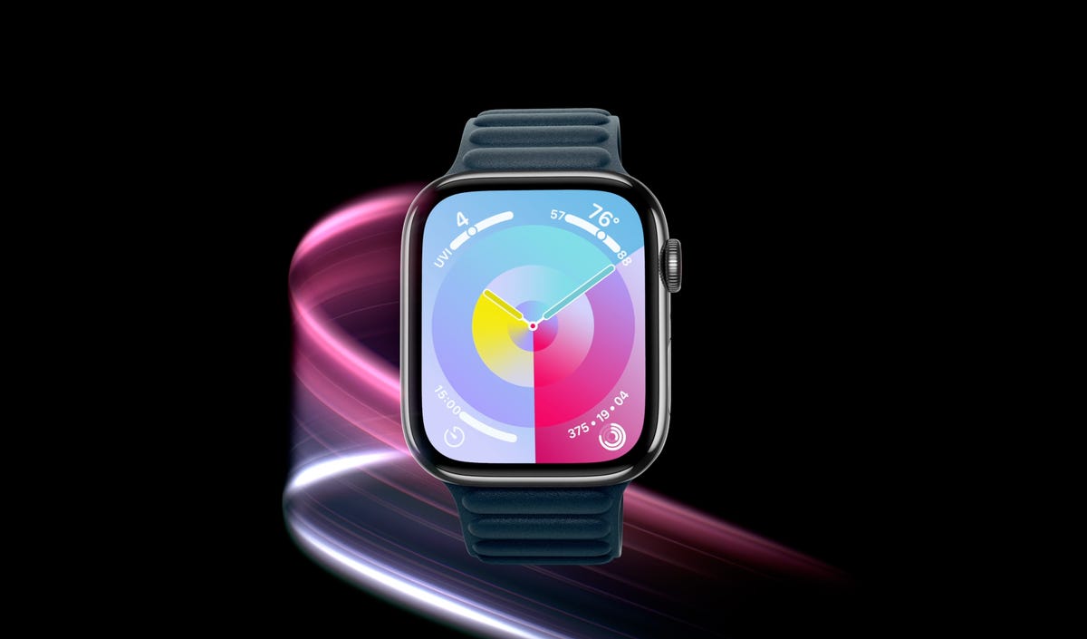 apple watch on black background with pink trails behind it