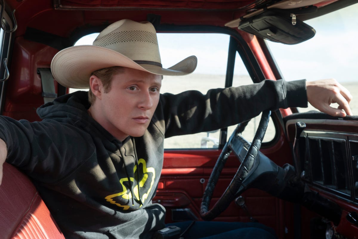 Cowboy Noah Tillerson drives his red truck.