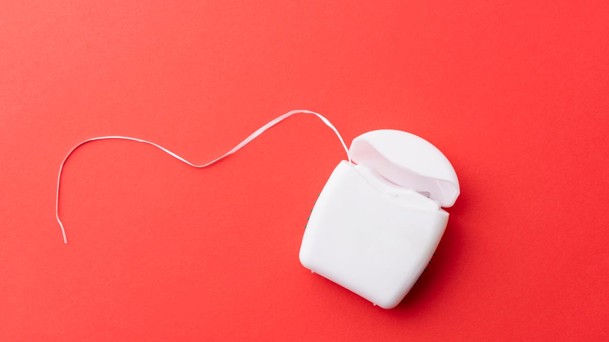 Dental floss and container.