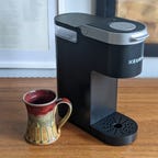The Keurig K-Mini and a coffee mug.