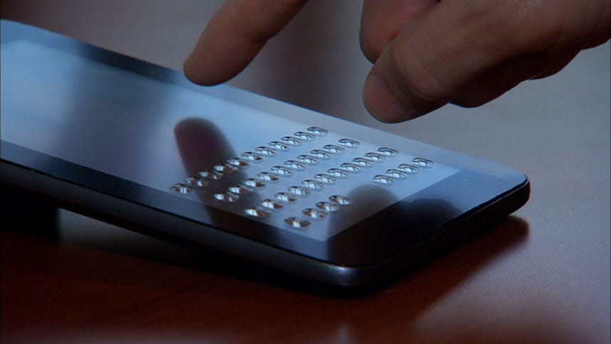 Keyboard bubbles up from touch screen on demand