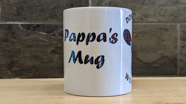 White mug that says Pappa's mug on it