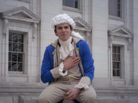 <p>Michael Gribble dons an appropriate wig to perform a Hamilton song written by AI.&nbsp;</p>