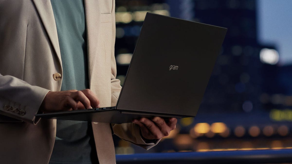 LG Gram laptop in someone's hands.