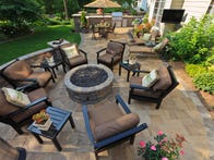 <p>Back yard gardens and patio from an elevated view.</p>