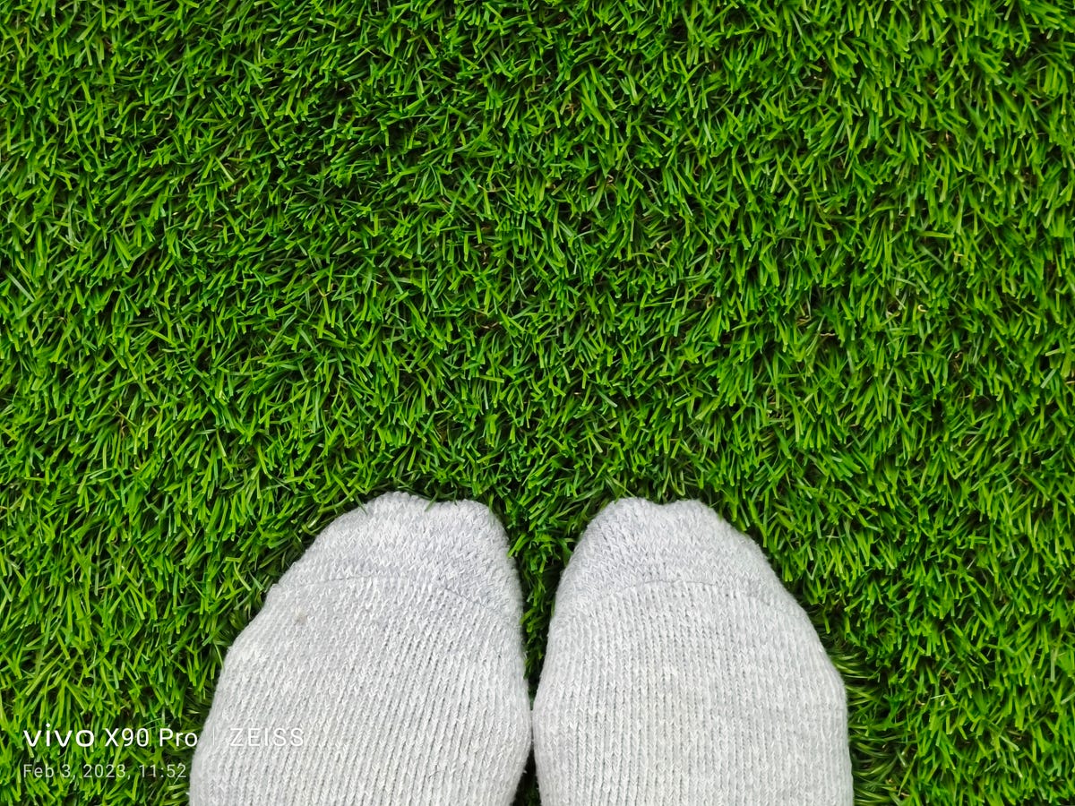 Feet with socks on artificial grass