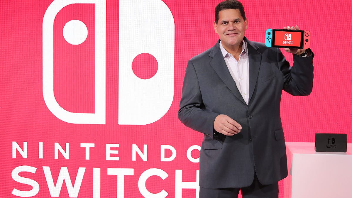 Nintendo of America President Reggie Fils-Aime. That Switch held in his hand is not actually a handheld. Not primarily anyway, he tells us.
