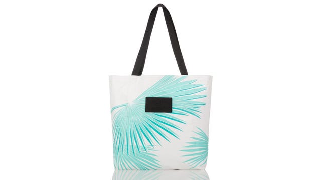 White and blue shopping bag with black handles