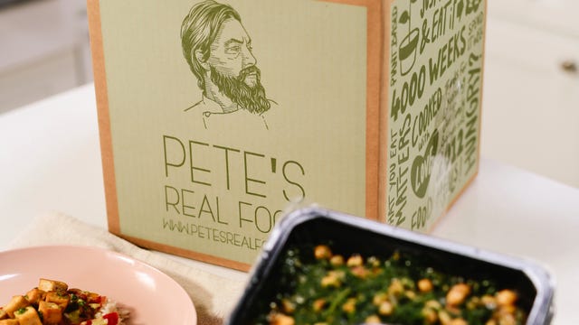 box of pete's food with meals in front