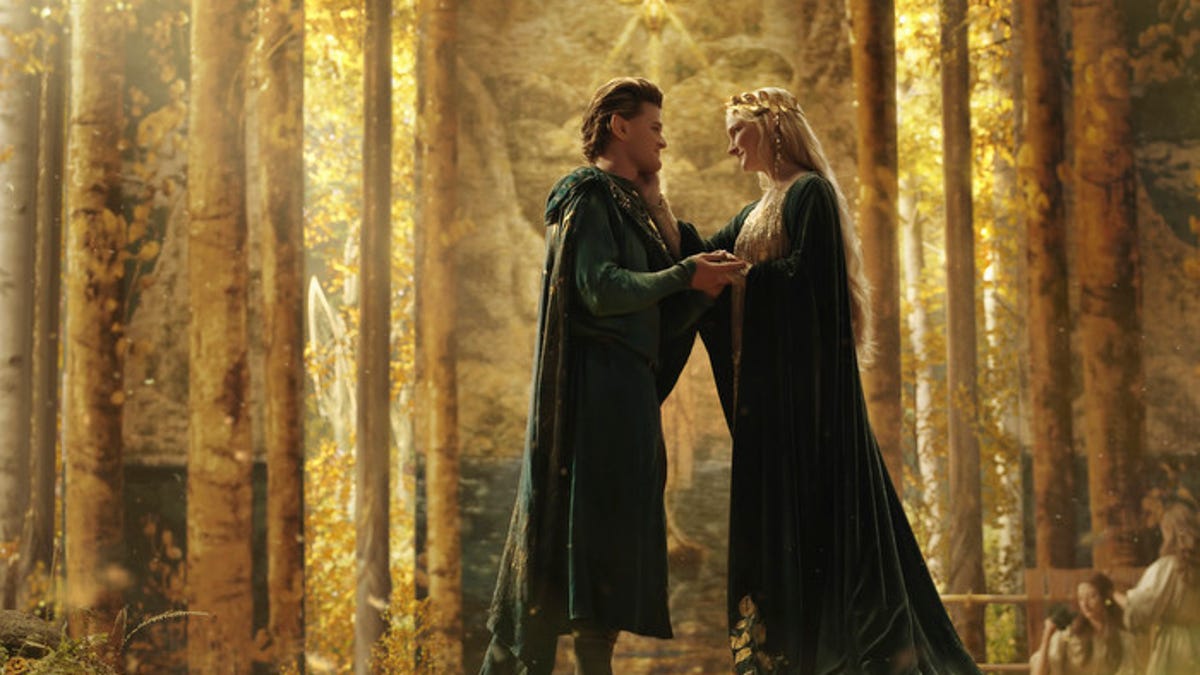 Elrond and Galadriel meet fondly in a golden forest