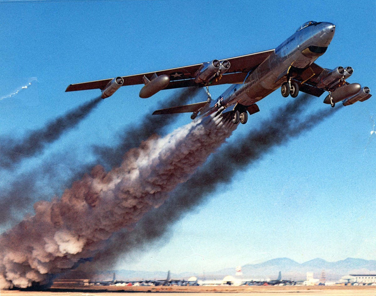 Boeing B-47B taking off with plumes of dark, smoky exhaust