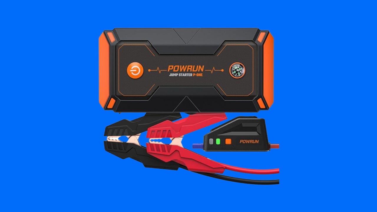 car jump starter battery pack with mini jumper cables on blue background