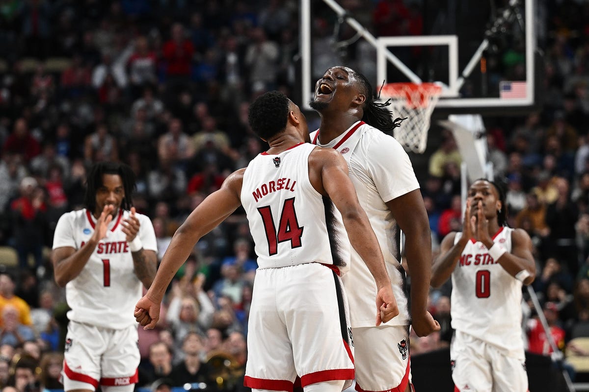 NC State players celebrate a basket in the 2024 March Madness tournament.