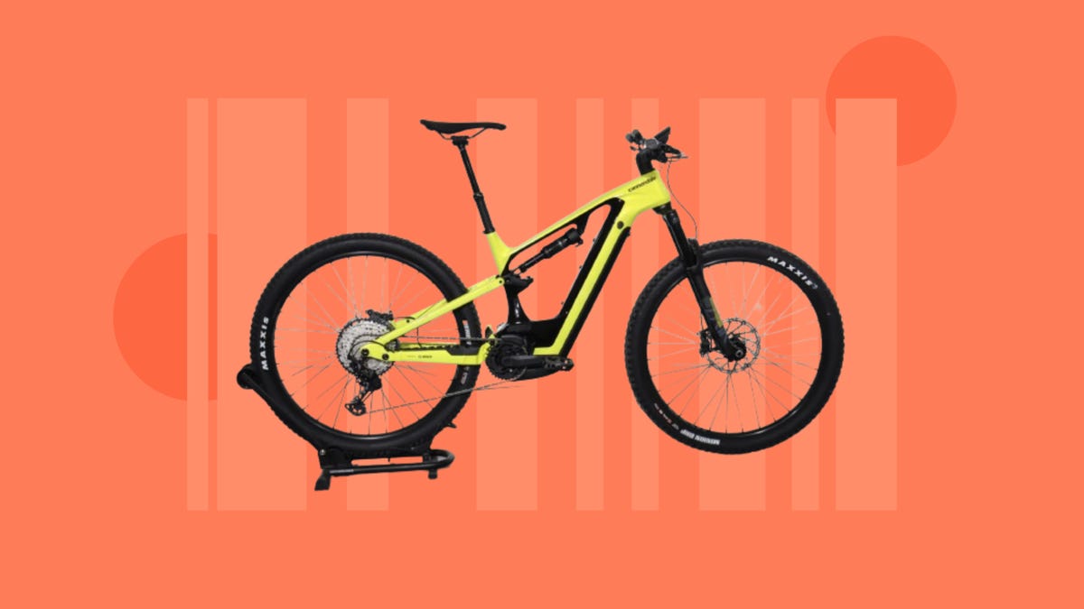 The Cannondale Moterra Carbon 2 e-bike is displayed against an orange background.