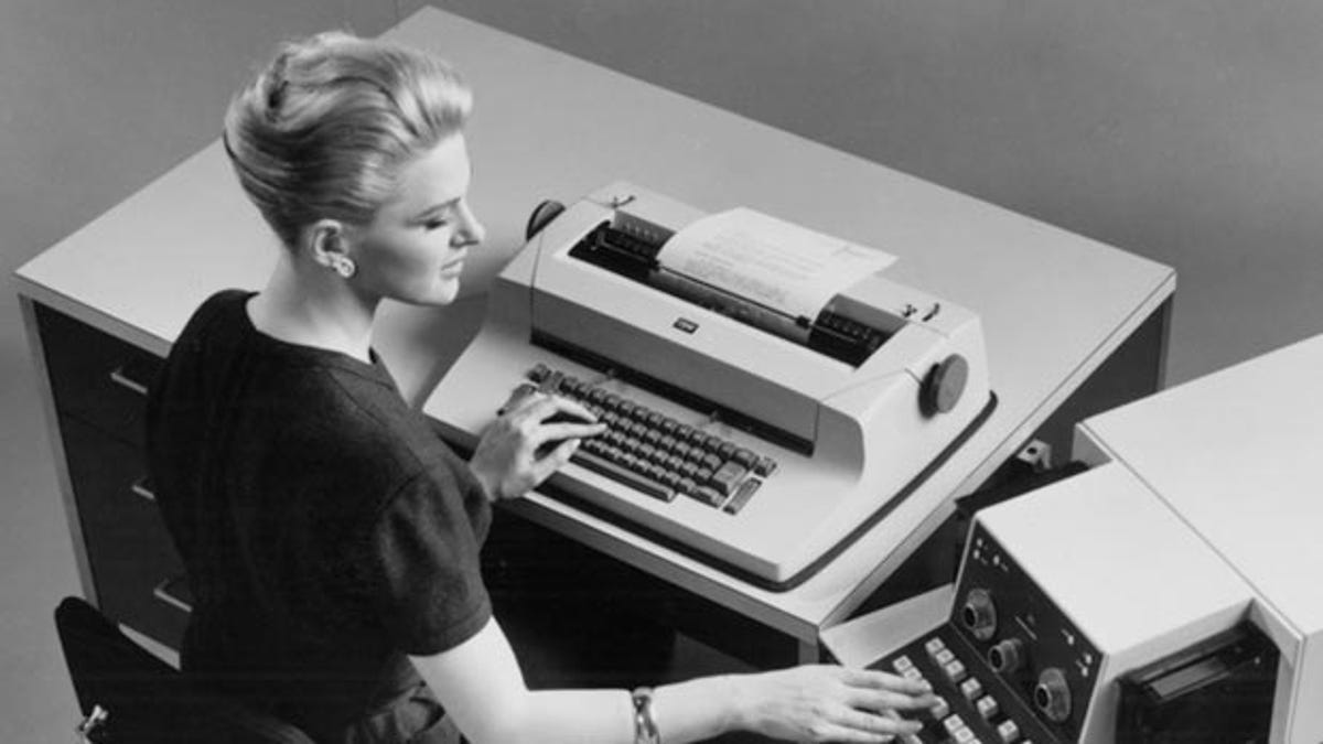 The IBM Selectric typewriter being used in an office.