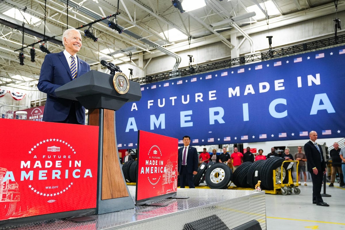 President Biden with "Made in America" signs