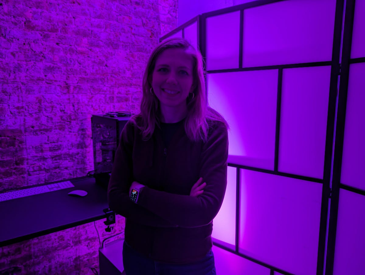A photo of CNET's Bridget Carey taken on the Pixel 7 in a dark room.