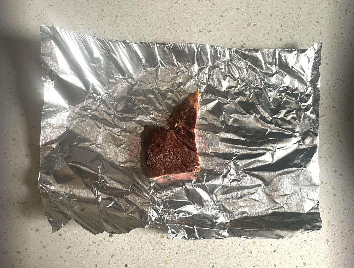 steak in foil on counter