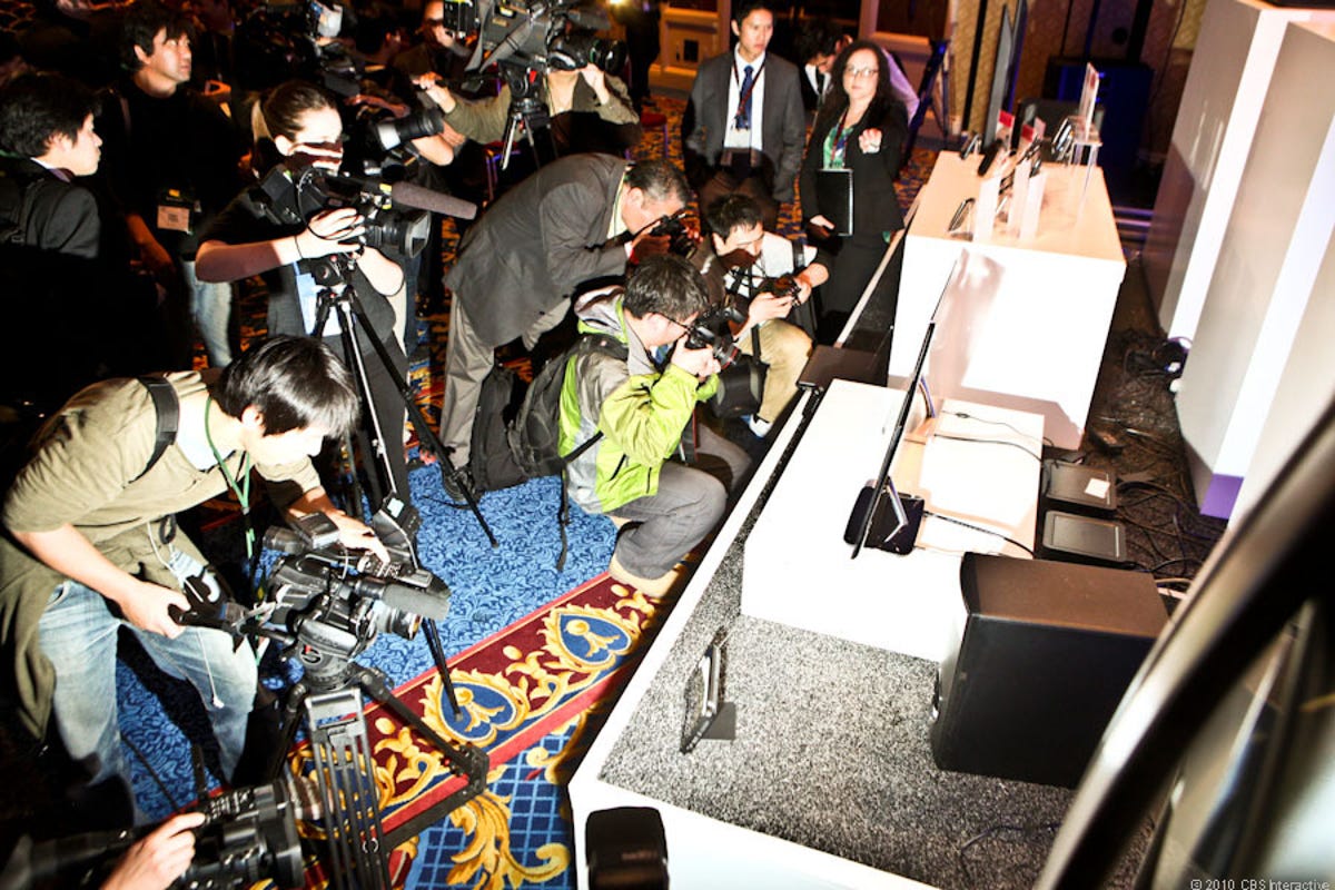 Members of the press crowd in to get a look at LG's newest devices following the press conference this morning at CES.