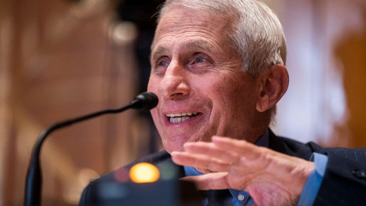 Anthony Fauci talks before a microphone