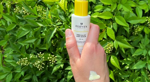 Hand holding EleVen Sunscreen