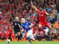 Everton's Steven Naismith and Liverpool's Steven Gerrard in Premier League action during the recent Liverpool derby at Anfield.