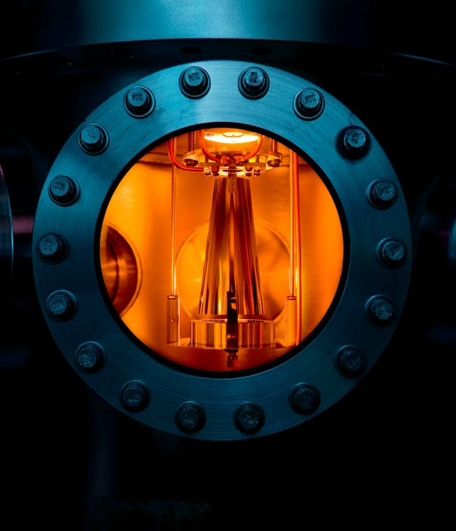 View through the port of a proton source test chamber.