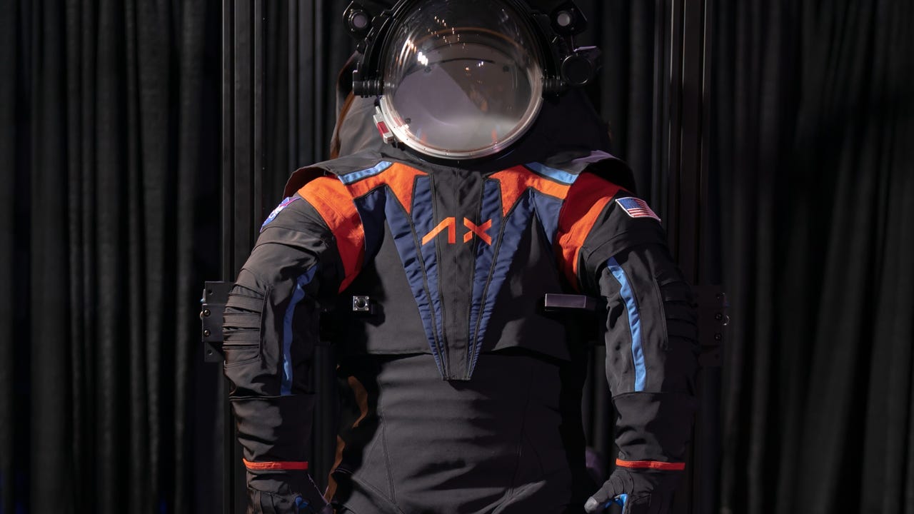 black astronaut suit and helmet design with blue and orange detail